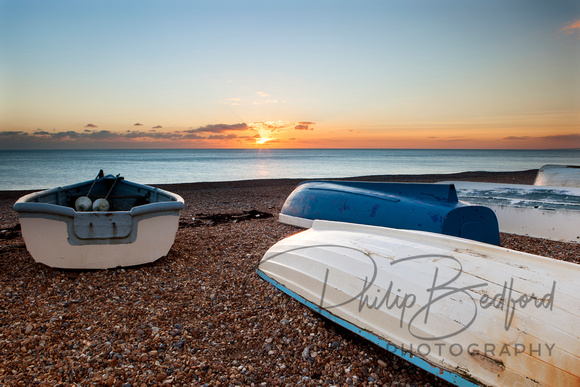 Boats on Seaford beach at Sunset